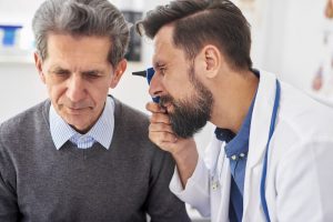 doctor examining ear