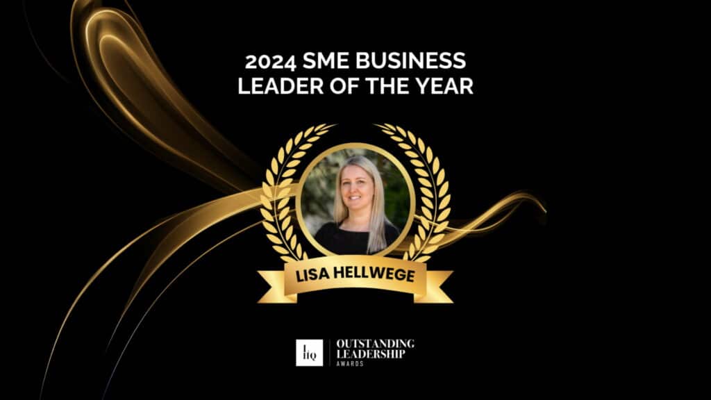 This image celebrates Lisa Hellwege as the 2024 SME Business Leader of the Year at the Outstanding Leadership Awards. It features a professional headshot of Lisa framed by a golden laurel wreath on a sleek black background with elegant gold accents, enhancing the prestigious feel of the award recognition.