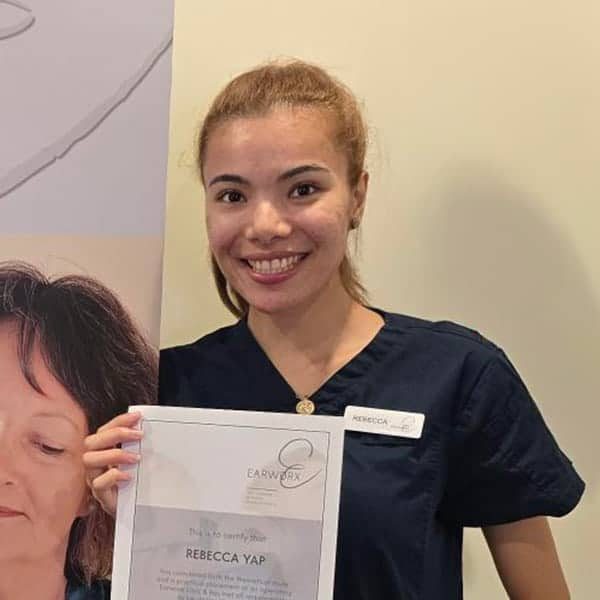 Headshot photo of a Woman holding a certificate